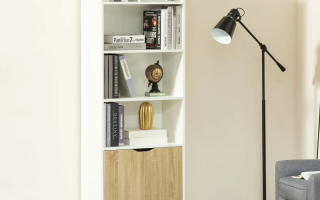 White bookshelf with books and décor beside floor lamp in modern living room.