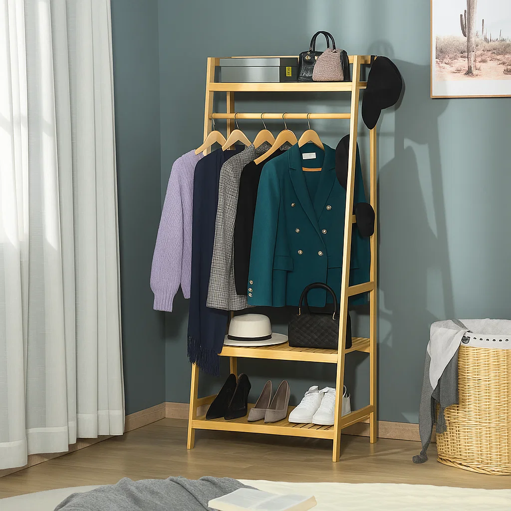 Clothing rack with blazers, sweaters, handbags, and shoes neatly arranged for a styled bedroom look.