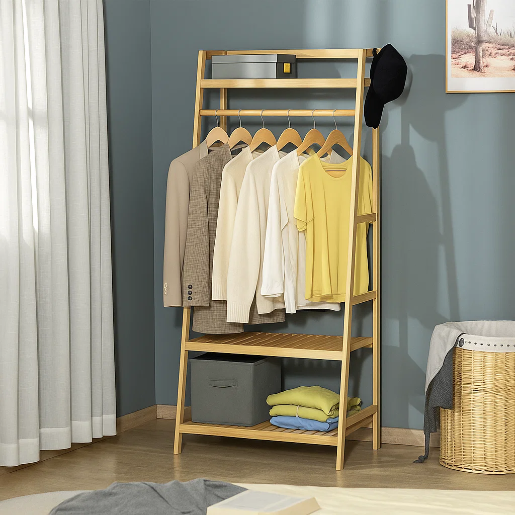 Clothing rack with jackets and shirts arranged by light to dark shades, folded garments placed below.