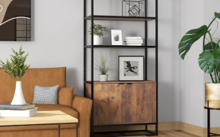 Modern bookshelf styled with books, plants, and framed art in cozy living room.