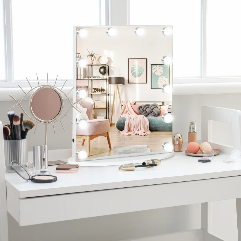 Hollywood lighted vanity mirror on white desk with makeup brushes and beauty accessories.