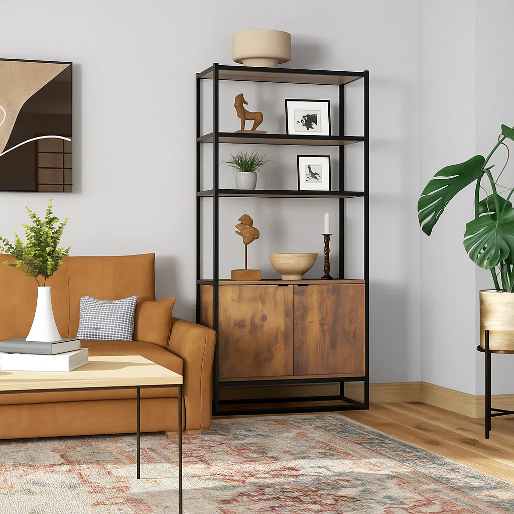 Modern bookshelf with wooden accents styled with vases, sculptures, and framed art in living room.