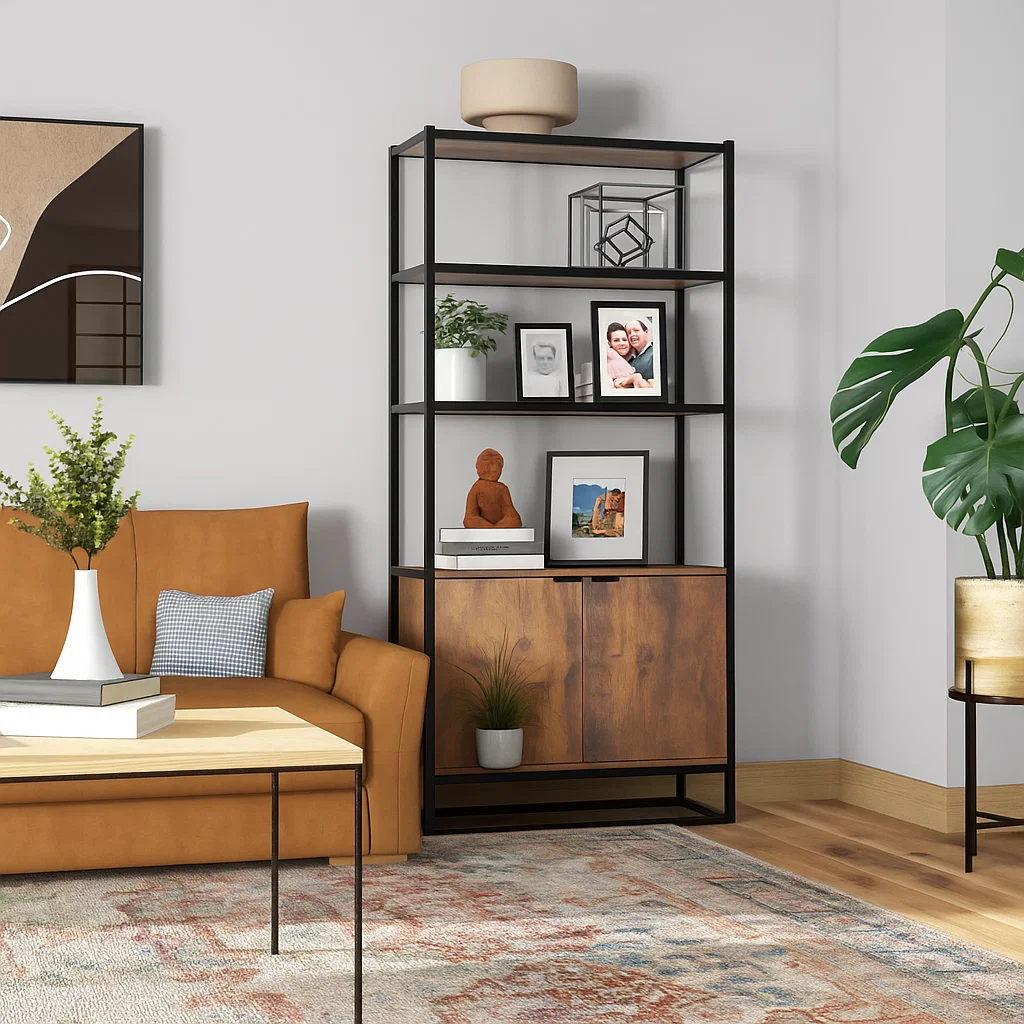Living room bookshelf styled with family photos, sculptures, and small plants for personalization.