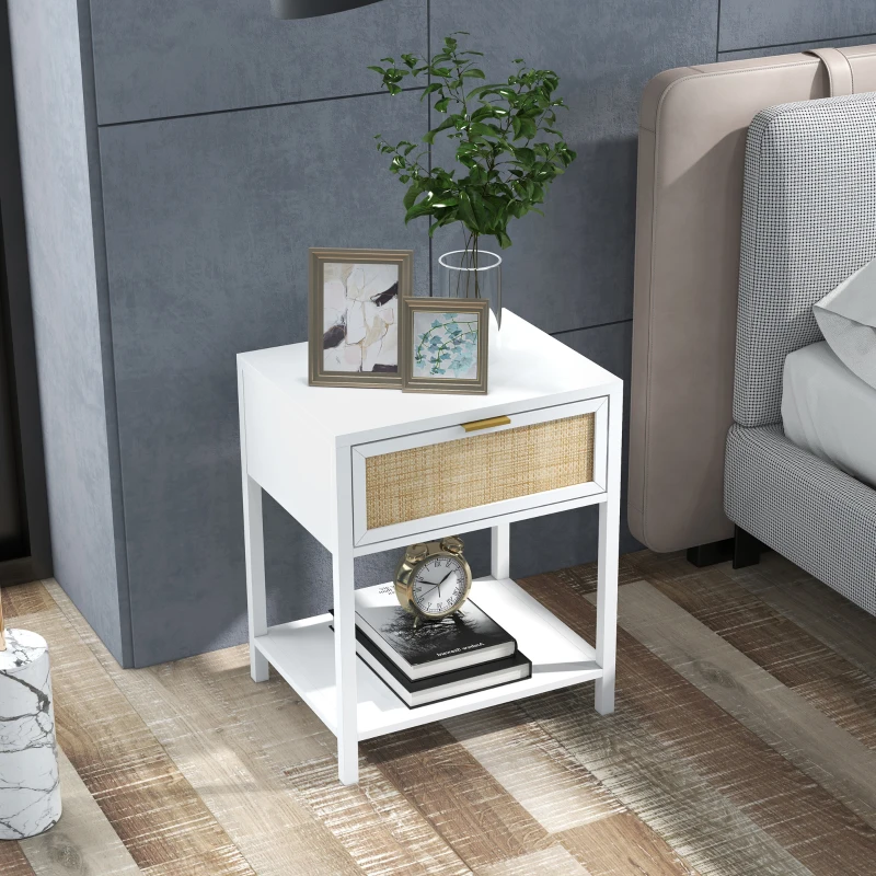 White boho bedside table with rattan drawer, decorated with plant, framed photos, and clock.