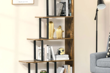 Rustic wood and metal bookshelf with staggered open shelves displaying books and décor items.