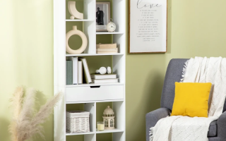 White bookshelf styled with books and home accessories.