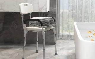 Rolling shower wheelchair placed next to a bed.