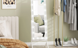 Mirror in bedroom reflecting sunlight creating a spacious feel.