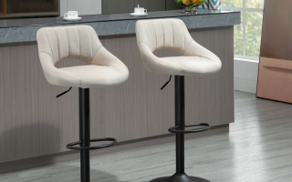Modern beige upholstered bar stools with curved backs in kitchen