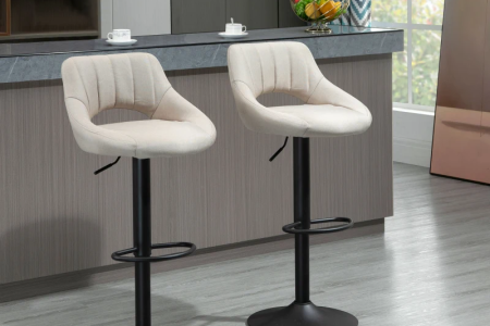 Modern beige upholstered bar stools with curved backs in kitchen