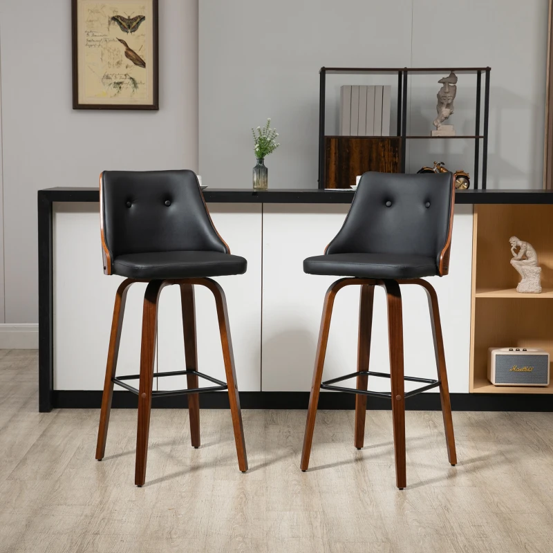 Gray cushioned bar stools with black metal legs by counter