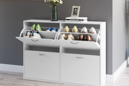 White shoe cabinet with multiple compartments in modern hallway