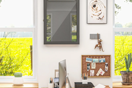 Modern home office wall with empty shadow box above desk.