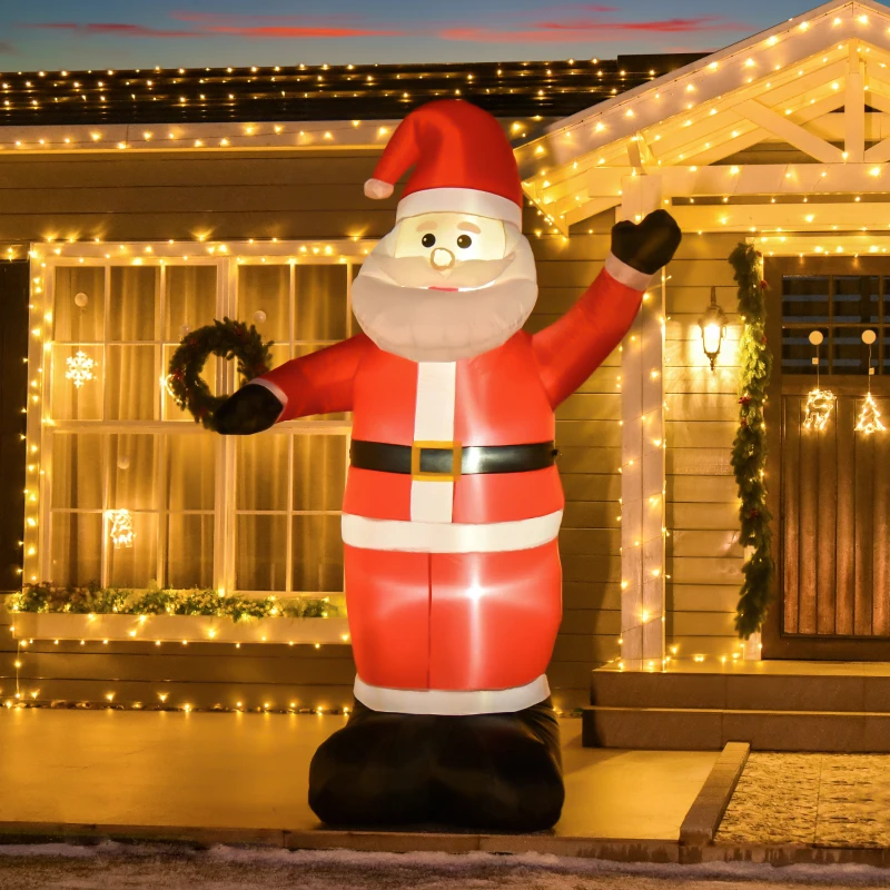 Large inflatable Santa glowing outdoors with festive house lights.