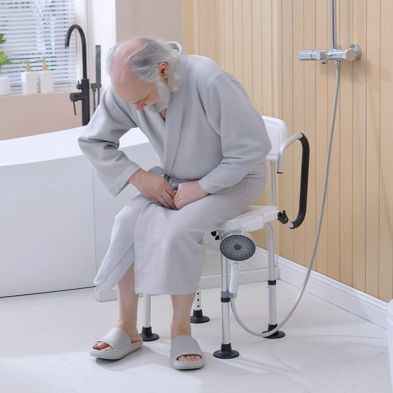 Elderly man sitting on bath chair in shower