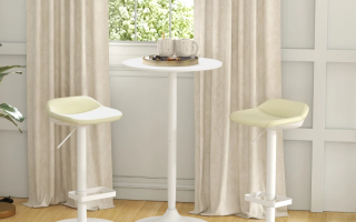 Modern white bar table set with two cream stools