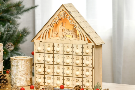 Wooden advent calendar with nativity scene design and festive décor.