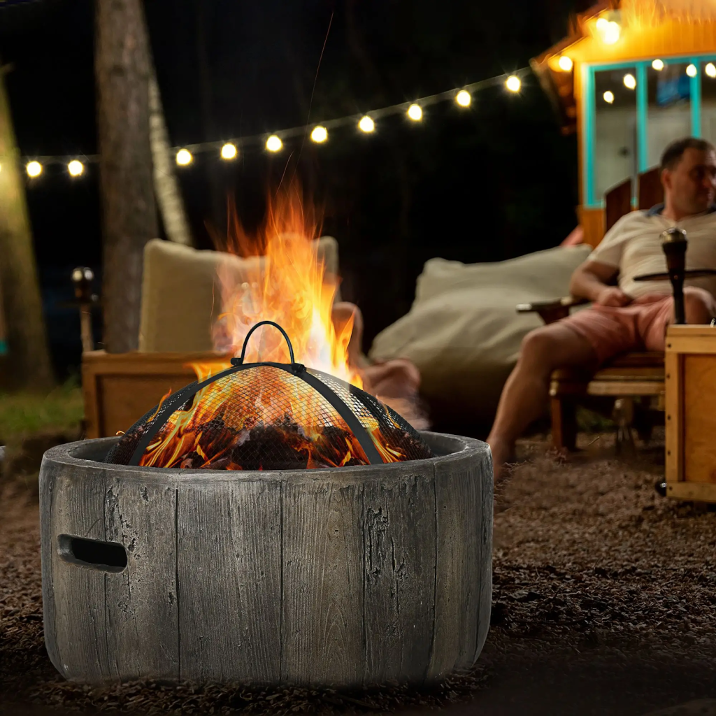 Stone fire pit burning brightly with chairs placed around