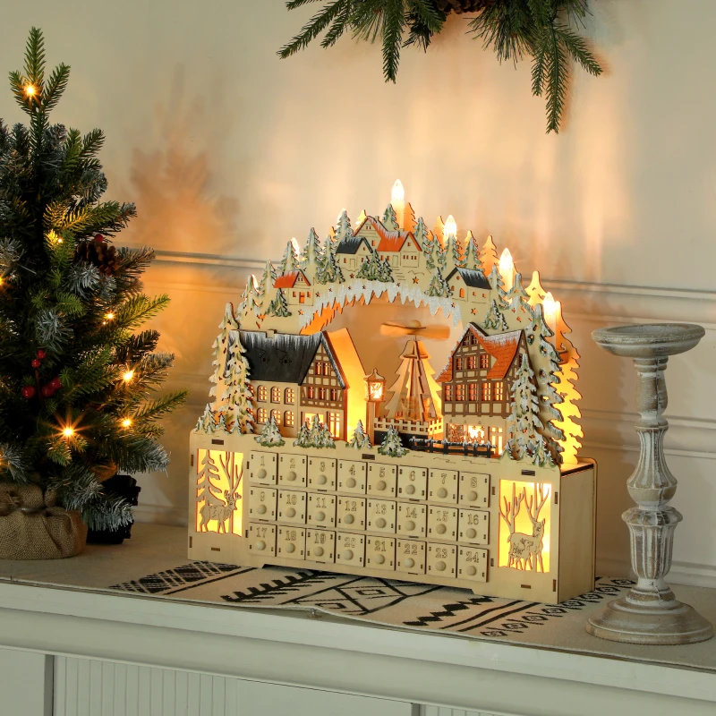 Lighted windmill village advent calendar with numbered drawers.