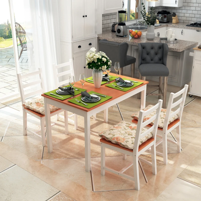 Armless high-back dining chairs around sleek white dining table.