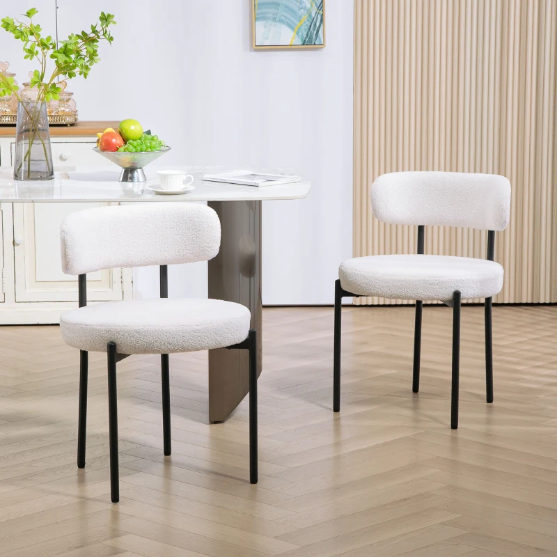Cozy berber fleece dining chairs with black steel legs.