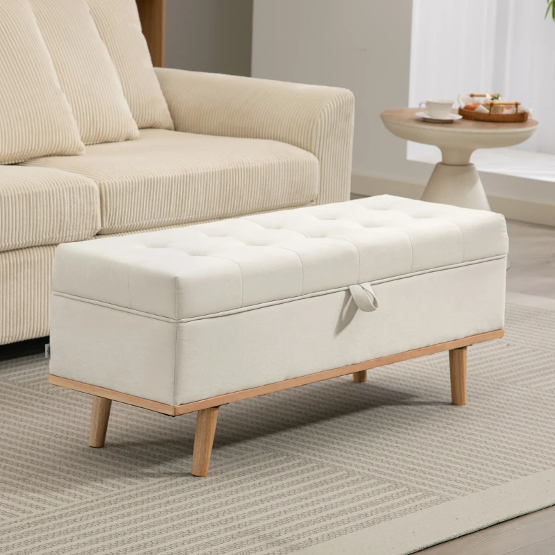 Tufted ottoman coffee table with hidden storage in living room.