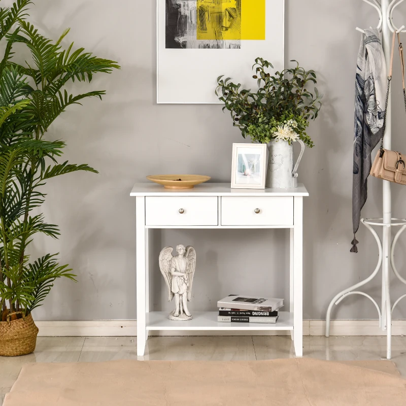 White entryway console table with drawers and open shelf decor.