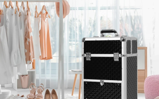 Pink rolling makeup train case with open drawers, displaying organized cosmetics in modern living room.