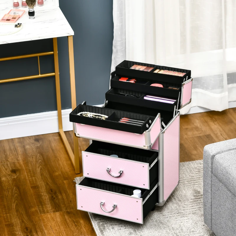 Black rolling makeup train case with silver trim, standing in bright modern dressing room.