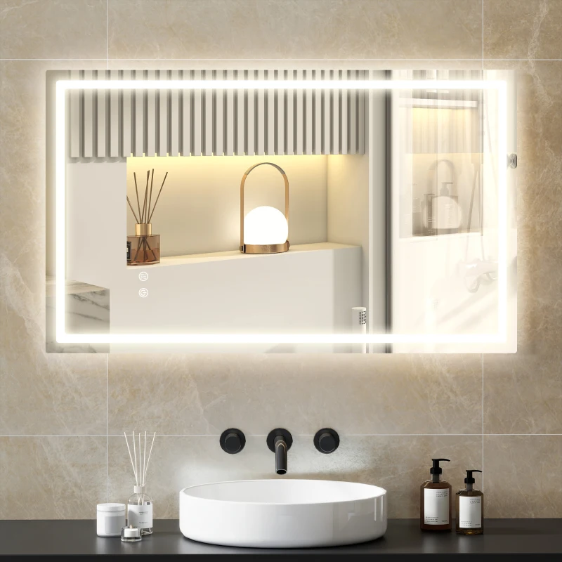Rectangular LED bathroom mirror glowing above white sink with modern fixtures.