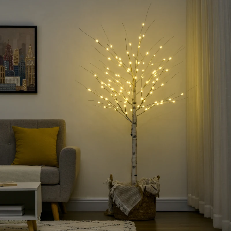 LED birch tree with glowing lights in modern living room corner.