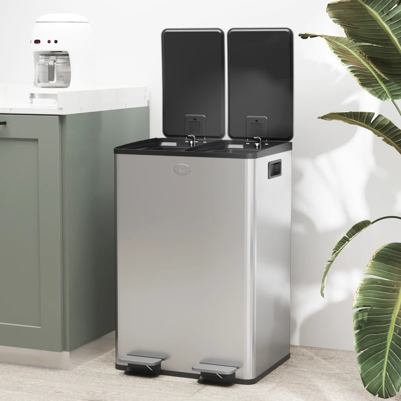 Stainless steel dual-compartment bin with open lids in kitchen.