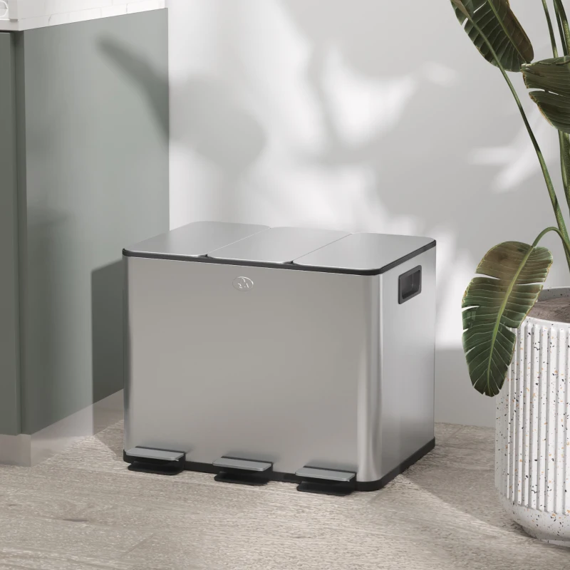 Stainless steel triple-compartment garbage bin with three pedals.