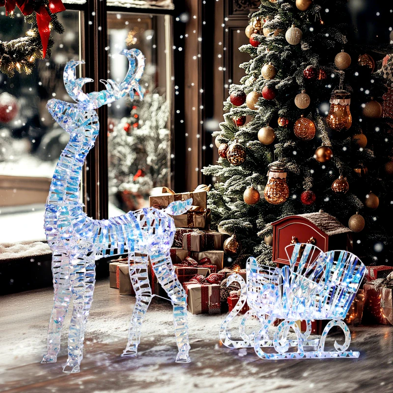 LED lighted reindeer and sleigh decoration beside Christmas tree.
