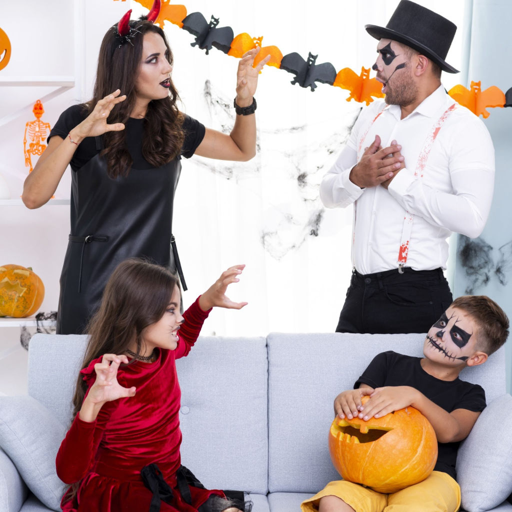 Family in costumes decorating living room with pumpkins and Halloween garland