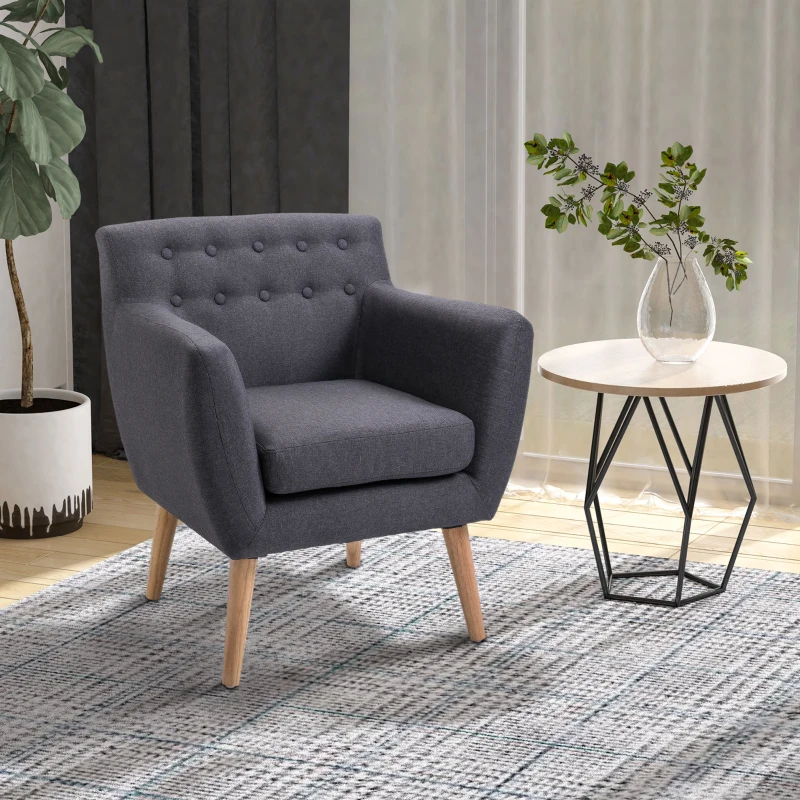 Dark gray armchair with wooden legs beside round table