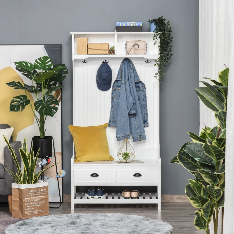 White hall tree with hooks, storage bench, and plants