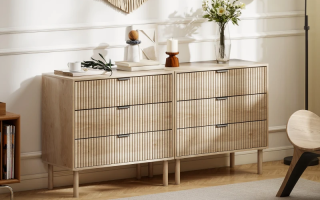 Modern wooden dresser with fluted drawers in bright living room
