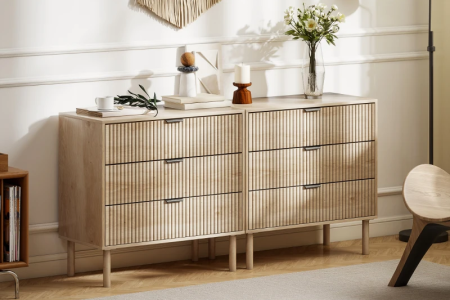 Modern wooden dresser with fluted drawers in bright living room