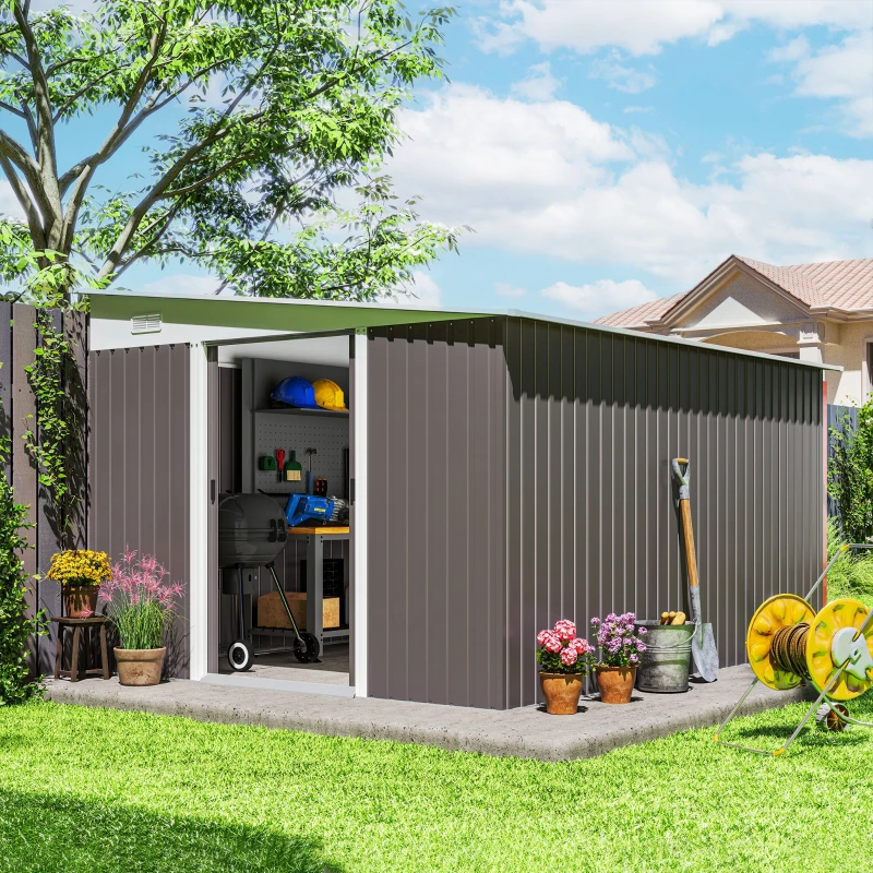 Large backyard metal shed with tools, plants, and garden decor.