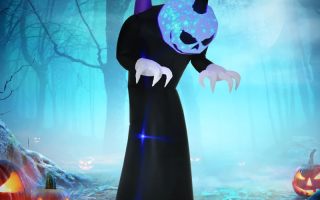 Creepy inflatable pumpkin-headed monster with glowing blue face in spooky forest.