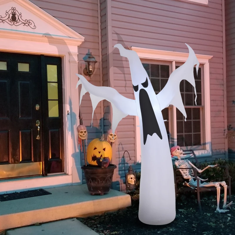 Inflatable white ghost with wide arms glowing on porch near skeleton.