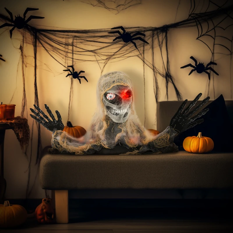 Glowing-eyed animated mummy skeleton crawling indoors with pumpkins and cobwebs.