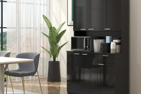 Black pantry cabinet with hutch, microwave, and storage jars in modern dining area.