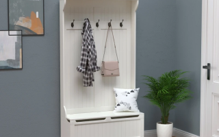Assembled HOMCOM 3-in-1 hall tree with coat hooks and bench.