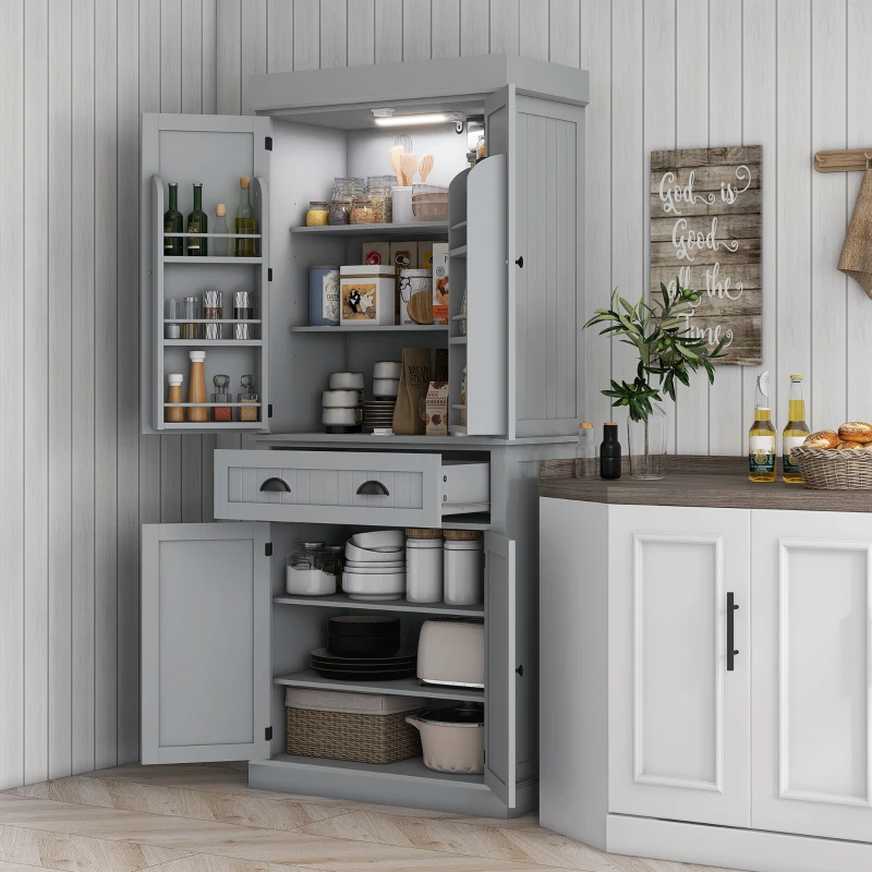 Grey pantry cabinet with open shelves, drawer, and door spice racks illuminated by LED light.