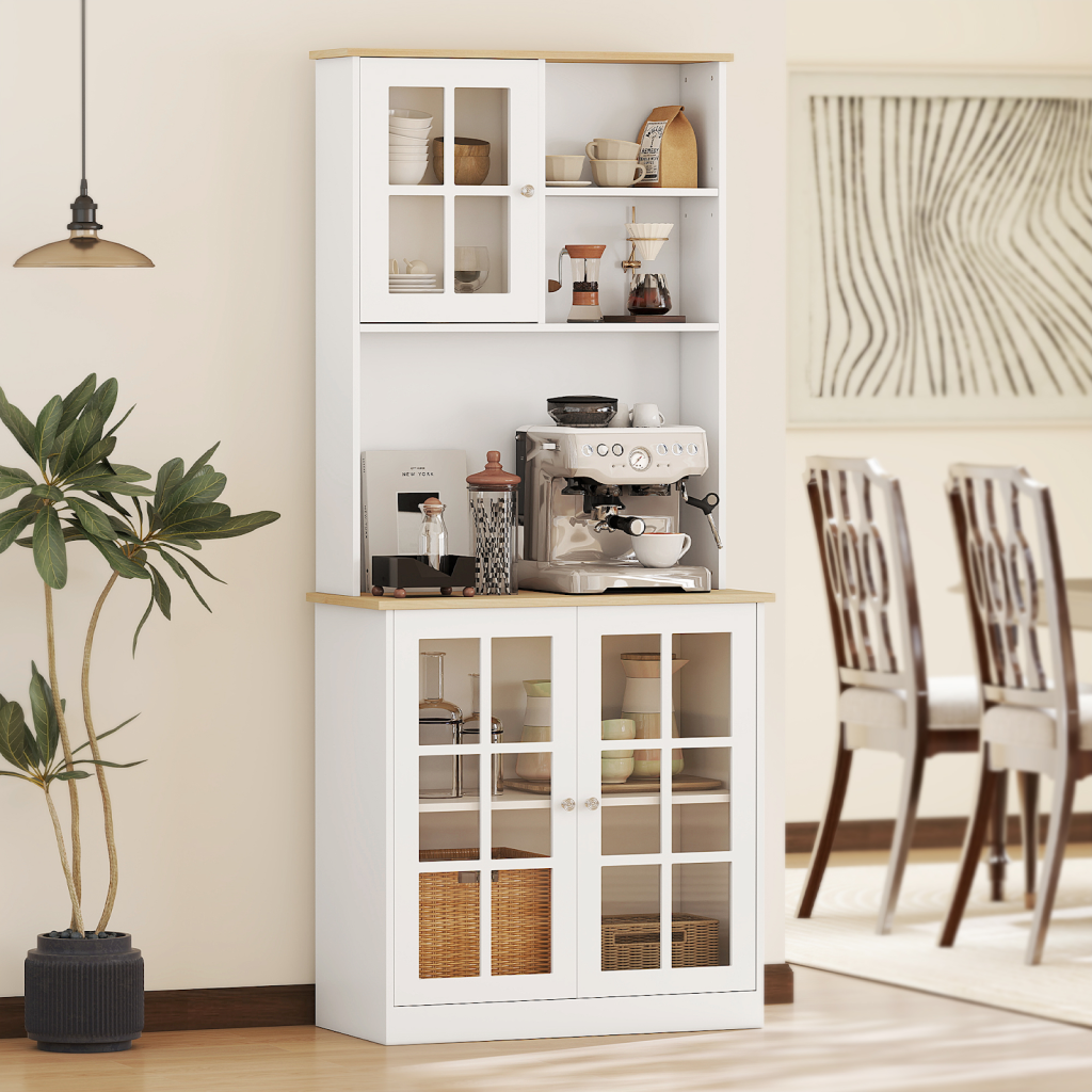 White pantry cabinet with glass doors, shelves, and coffee station setup in dining room.