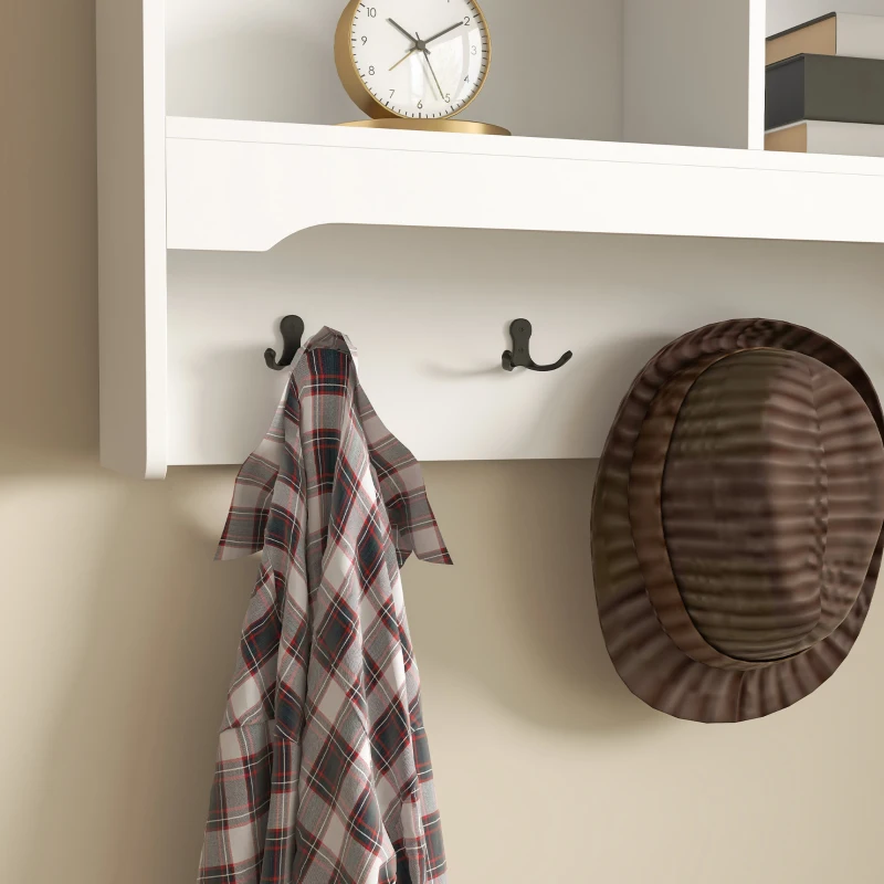 Wall-mounted coat rack with shelves and hooks holding hats, jackets, and decorative accents.
