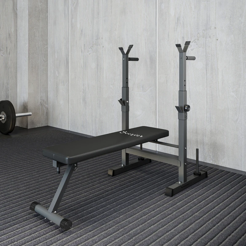 Foldable weight bench with barbell rack and dip station