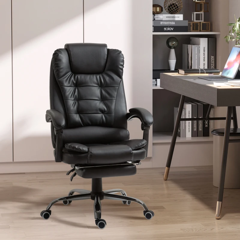 Black leather executive chair with reclining back and leg rest